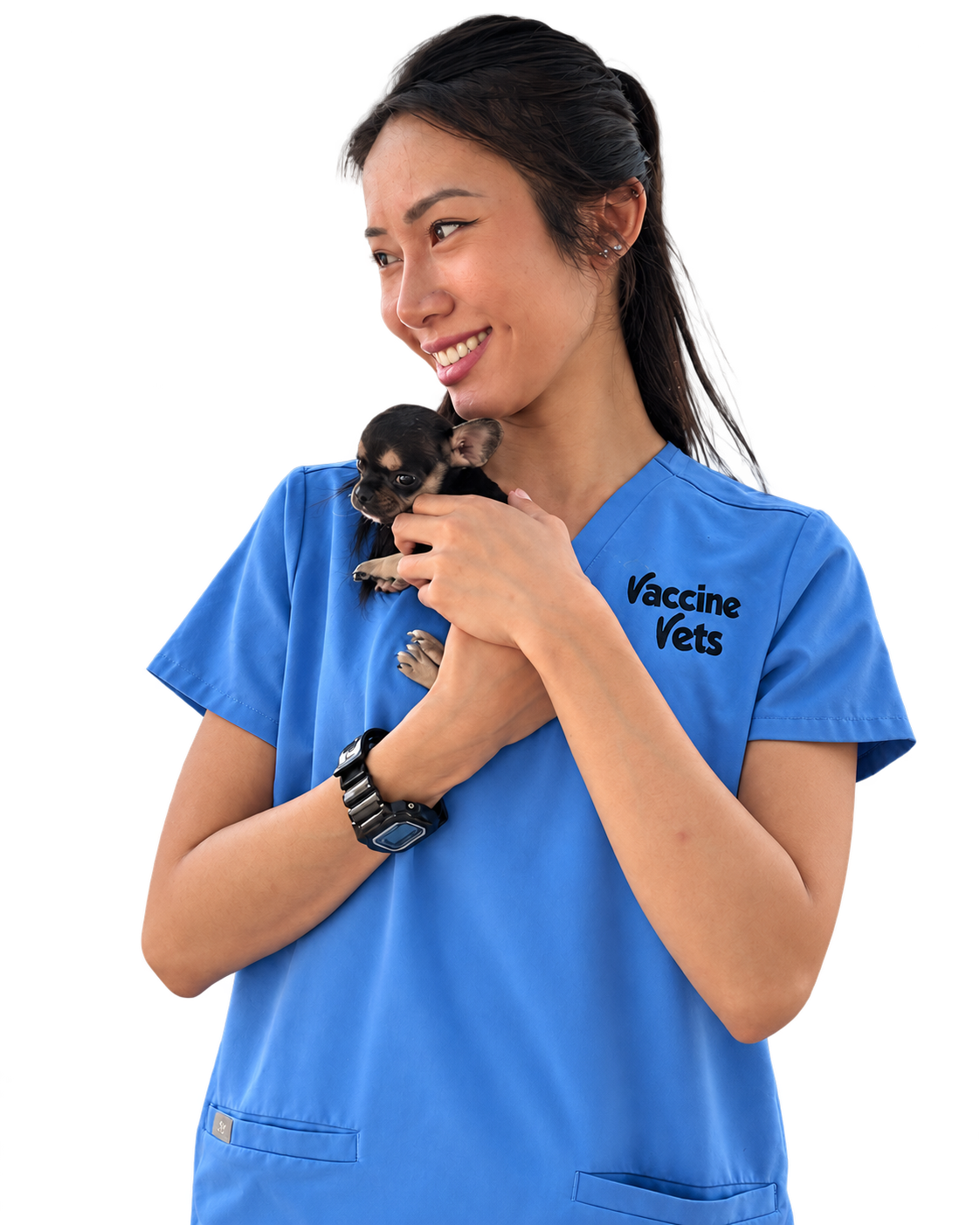 Una integrante del equipo de Vaccine Vets con un cachorro